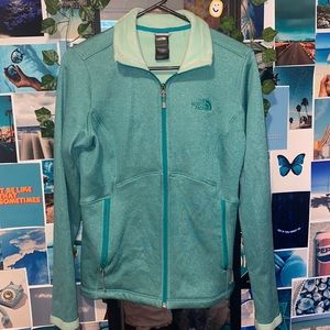 North face zip up tight fitting jacket. Size M.